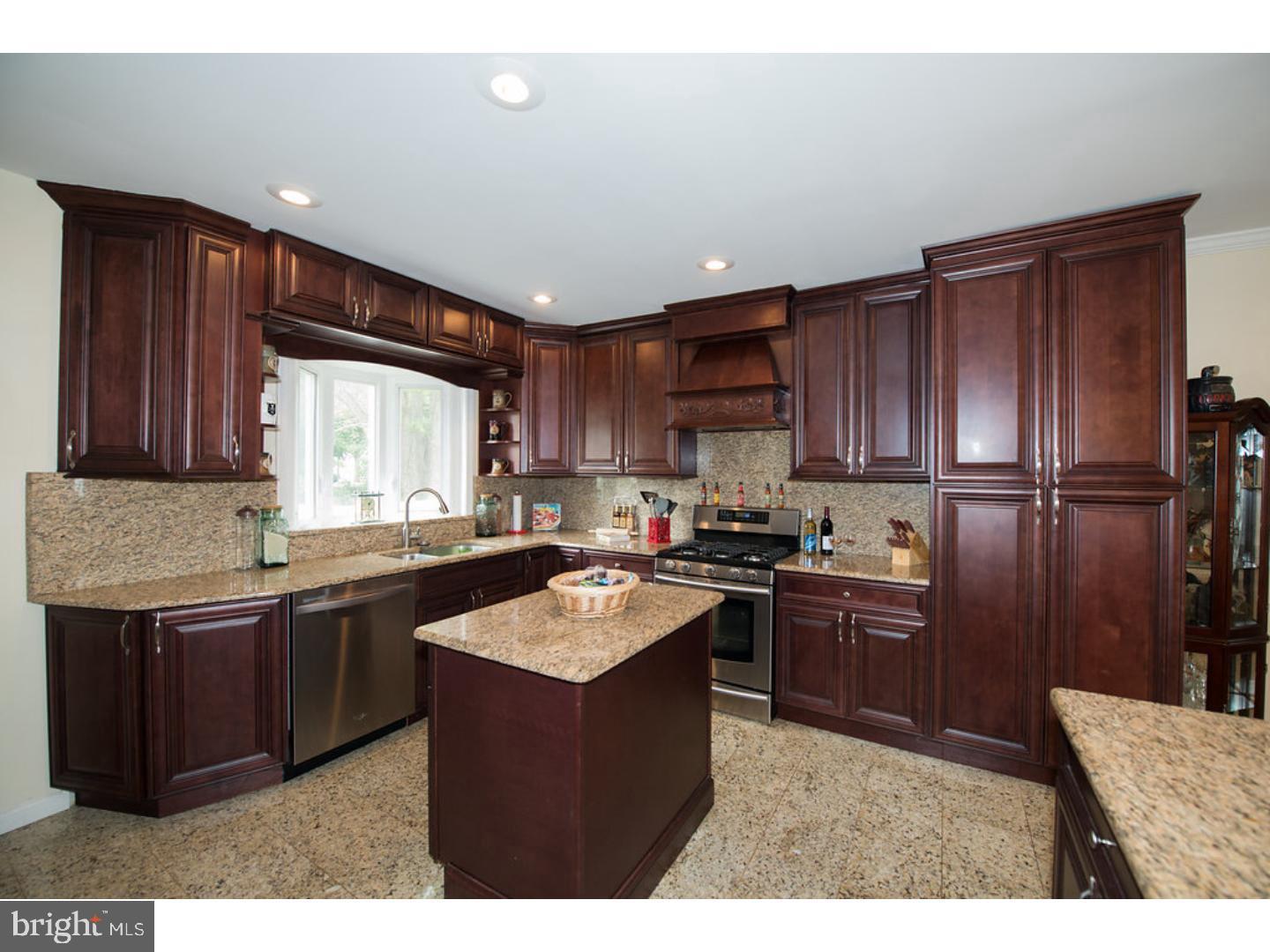 1755 Rockwell Road Abington, PA 19001 - Photo 7 of 19 a kitchen with granite countertop stainless steel appliances and wooden cabinets