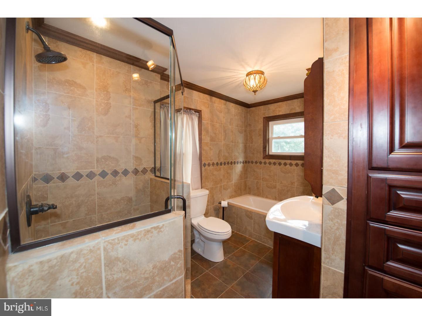 1755 Rockwell Road Abington, PA 19001 - Photo 8 of 19 a bathroom with a toilet sink and shower