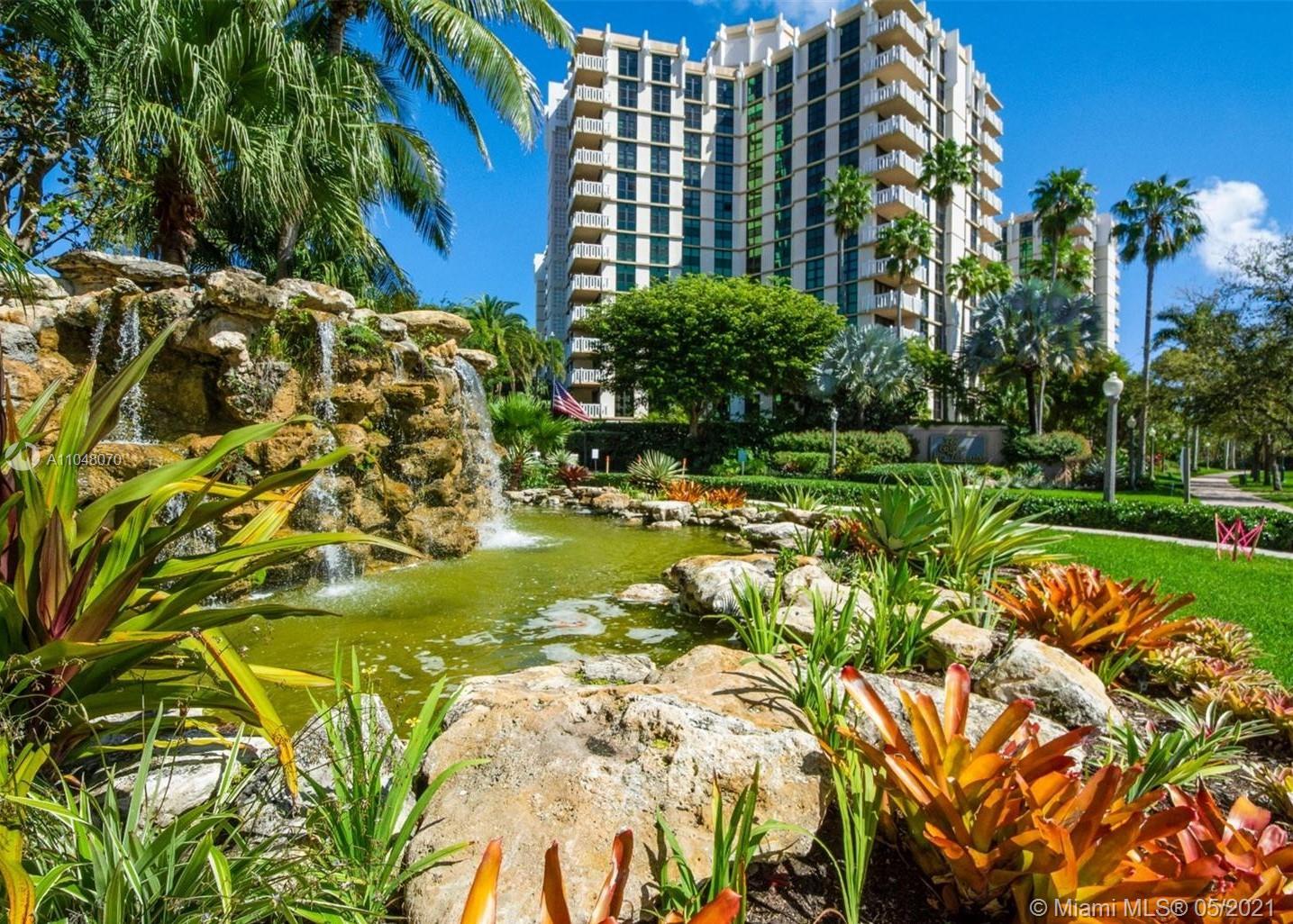 1121 Crandon Boulevard, Unit D404 Key Biscayne, FL 33149 - Photo 14 of 27 a view of a swimming pool with a yard and plants