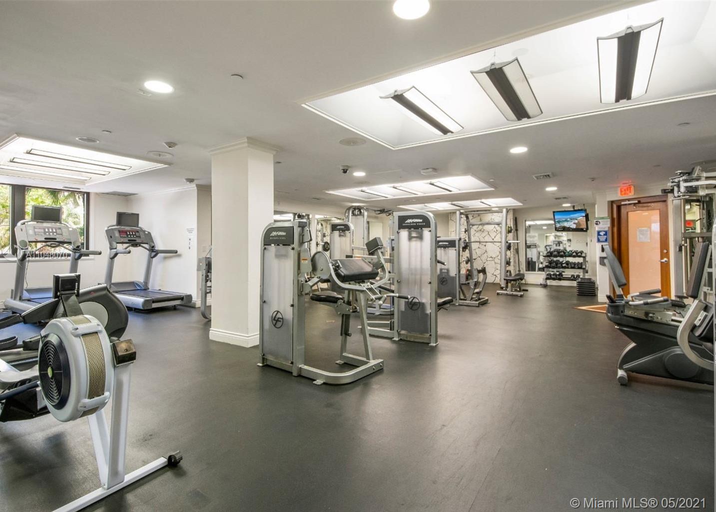 1121 Crandon Boulevard, Unit D404 Key Biscayne, FL 33149 - Photo 20 of 27 a view of a room with gym equipment