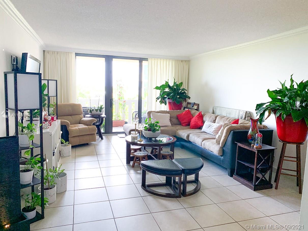 1121 Crandon Boulevard, Unit D404 Key Biscayne, FL 33149 - Photo 3 of 27 a living room with furniture flowerpot and wooden floor