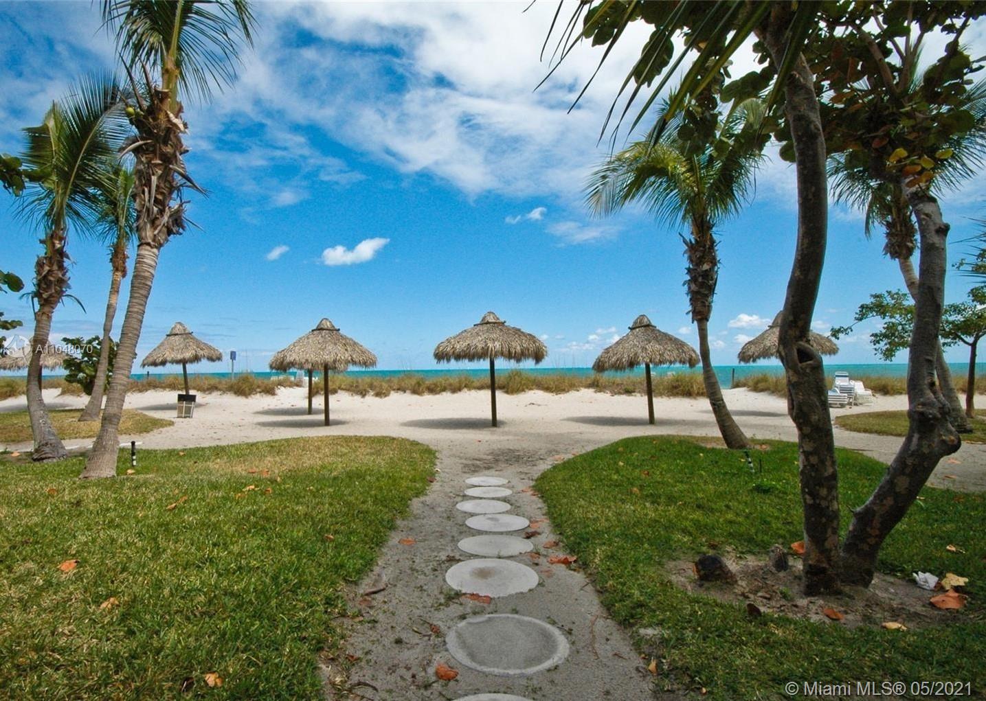 1121 Crandon Boulevard, Unit D404 Key Biscayne, FL 33149 - Photo 26 of 27 a view of an outdoor space with garden