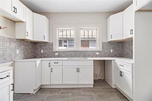 665 Lexington Avenue Southwest Atlanta, GA 30310 - Photo 5 of 33 a kitchen with granite countertop white cabinets and white appliances