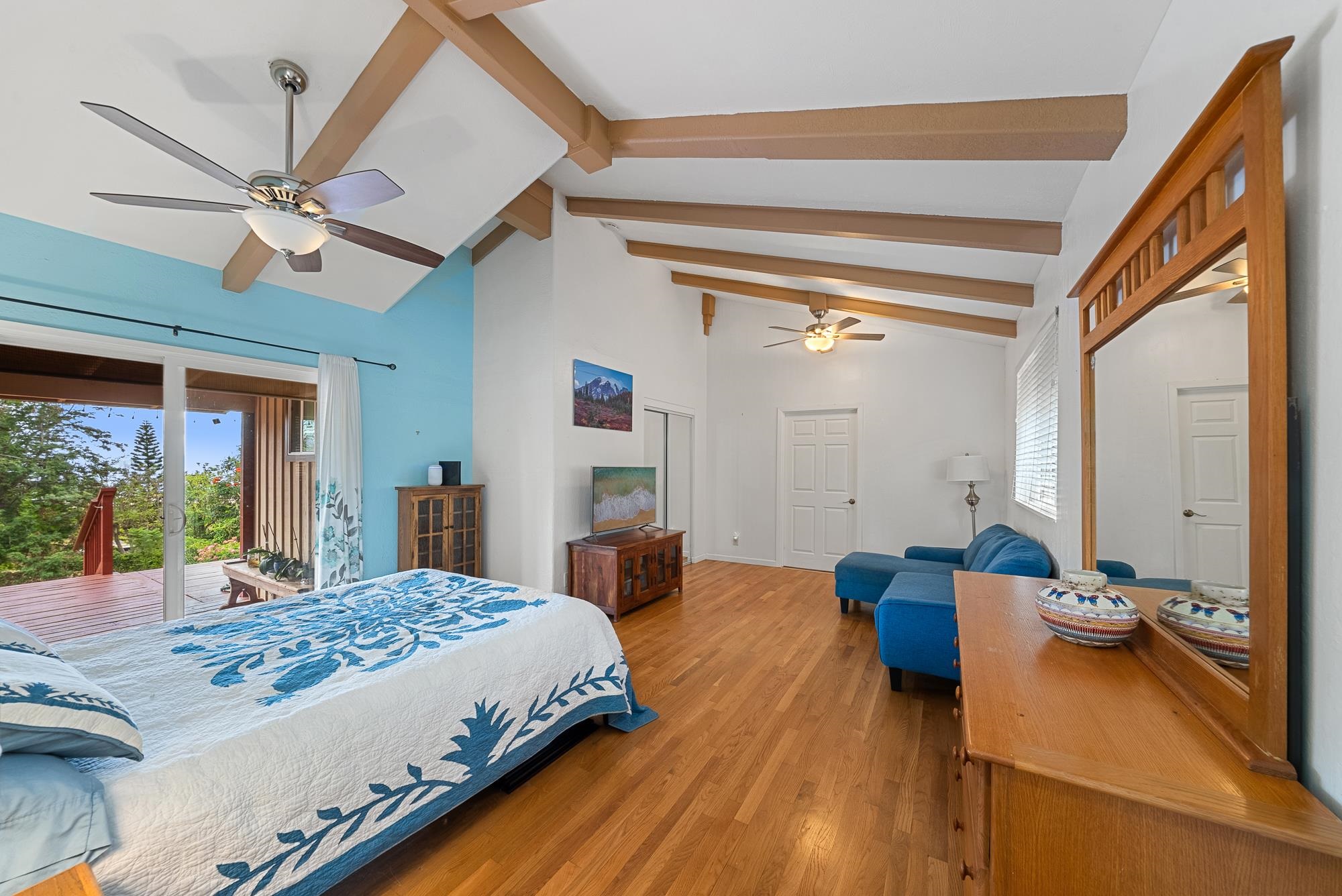 20 Pea Place Kula, HI 96790 - Photo 12 of 49 a bedroom with a bed and a large mirror on the dresser