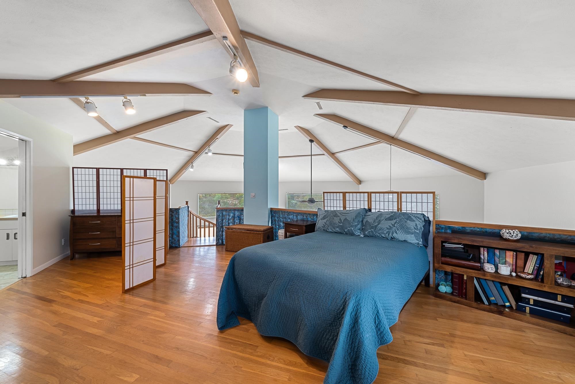 20 Pea Place Kula, HI 96790 - Photo 16 of 49 a bedroom with a bed furniture and a book shelf