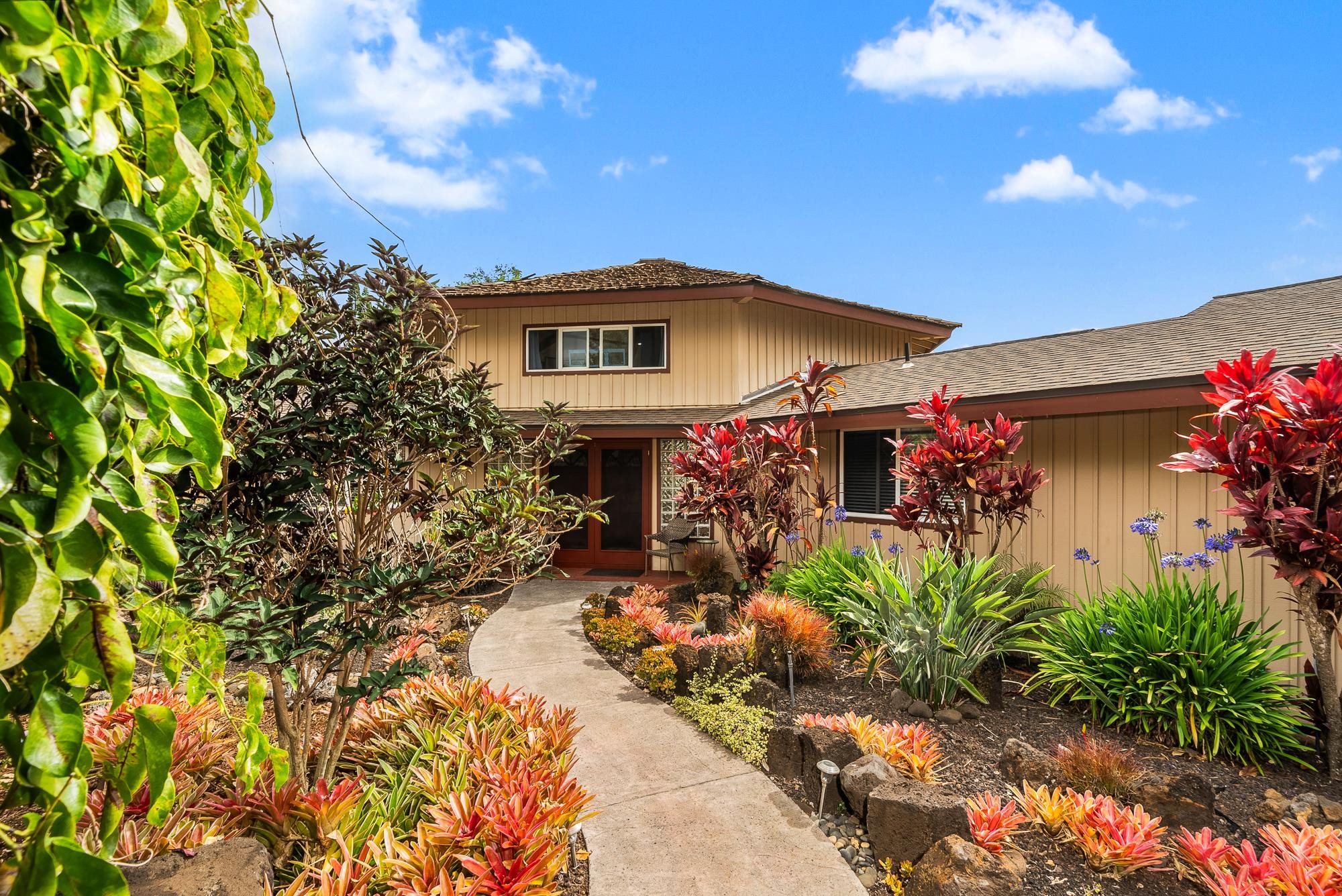 20 Pea Place Kula, HI 96790 - Photo 2 of 49 a front view of a house with a yard
