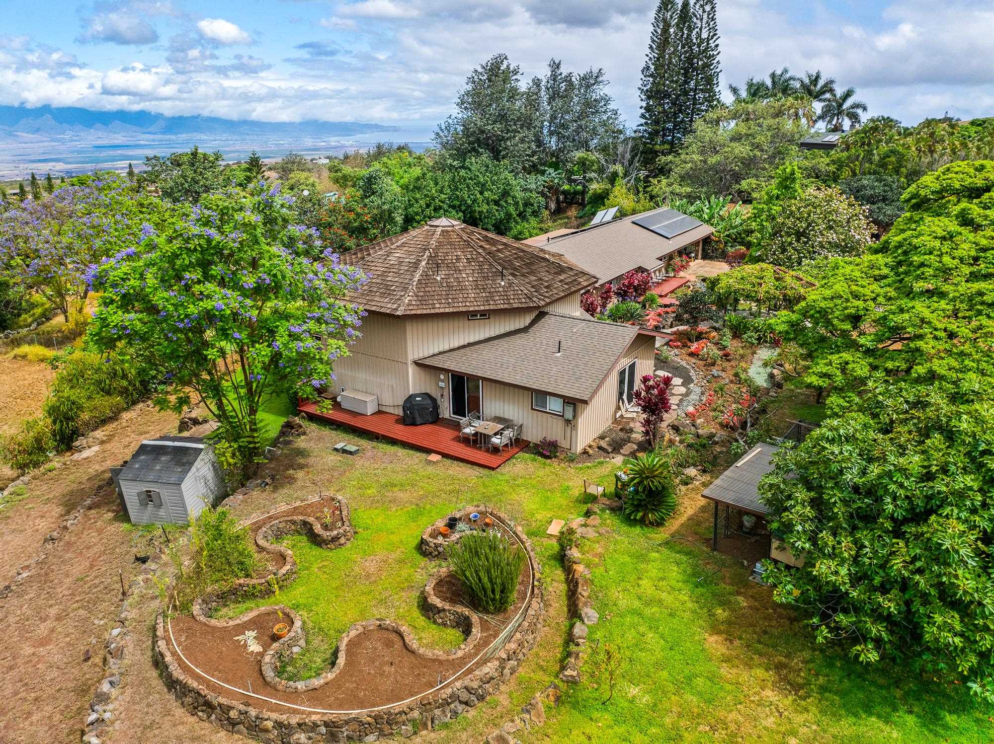 20 Pea Place Kula, HI 96790 - Photo 28 of 49 a aerial view of a house with swimming pool lawn chairs and flower plants