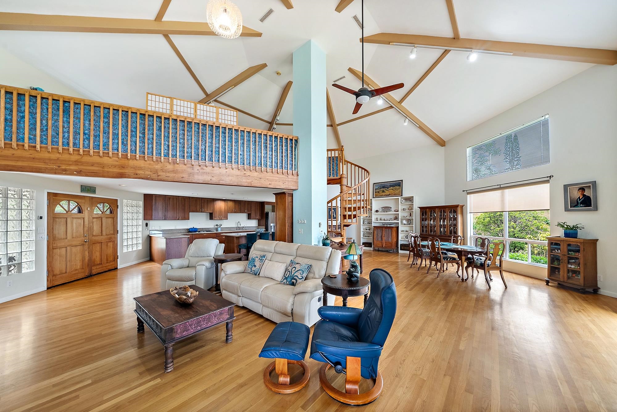 20 Pea Place Kula, HI 96790 - Photo 6 of 49 a living room with furniture a wooden floor and a chandelier