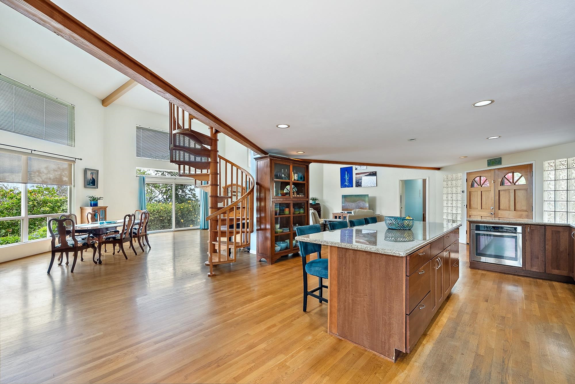 20 Pea Place Kula, HI 96790 - Photo 8 of 49 a open kitchen with stainless steel appliances granite countertop a stove and chairs with wooden floors