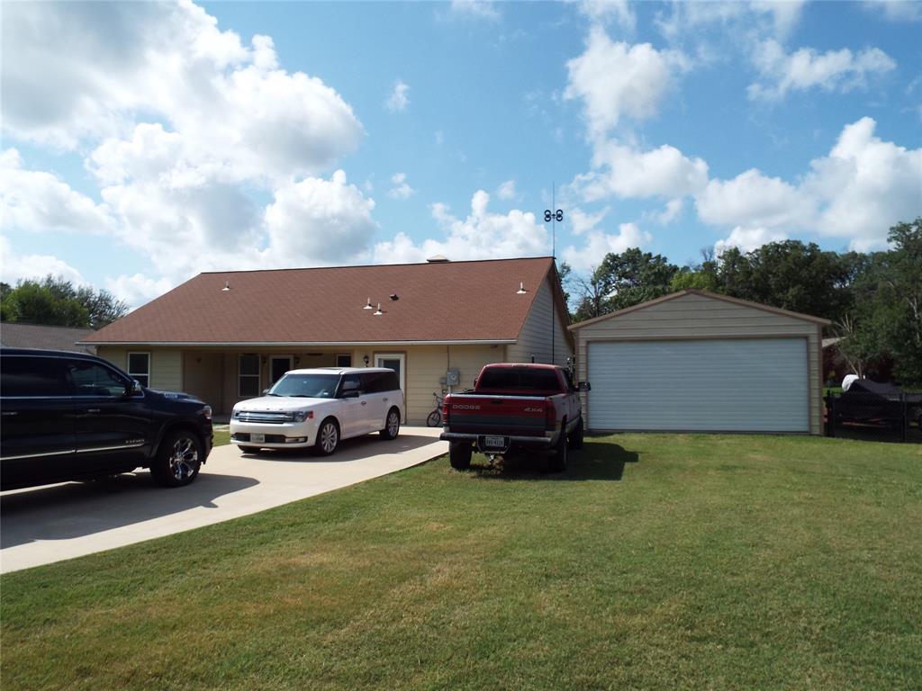 721 Midway Road Tool, TX 75143 - Photo 15 of 30 a car parked in front of a house with a yard