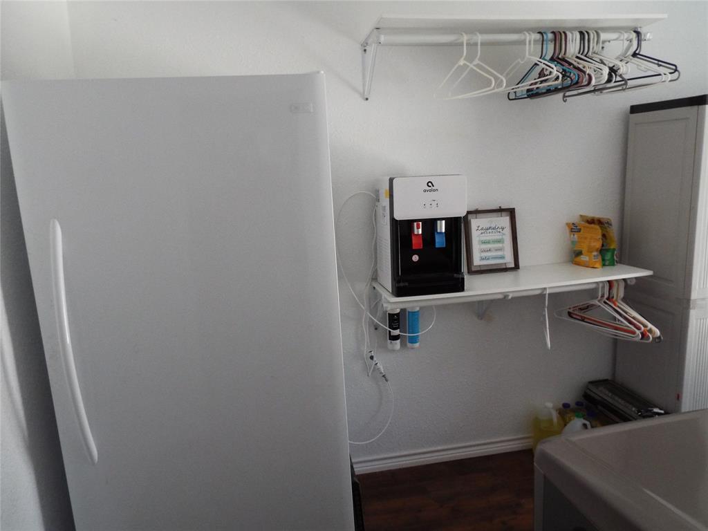 721 Midway Road Tool, TX 75143 - Photo 21 of 30 a view of storage and utility room with racks on the wall