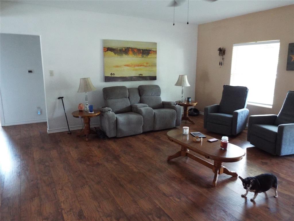 721 Midway Road Tool, TX 75143 - Photo 24 of 30 a living room with furniture and a wooden floor