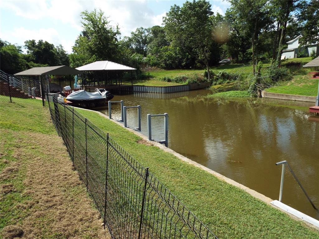 721 Midway Road Tool, TX 75143 - Photo 27 of 30 a view of a lake with a patio