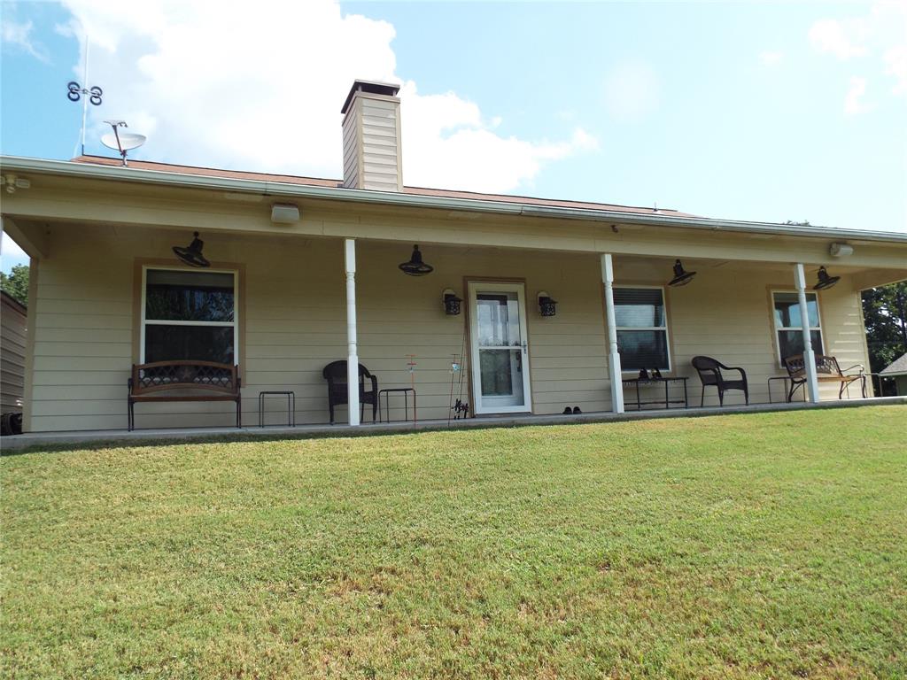 721 Midway Road Tool, TX 75143 - Photo 3 of 30 a view of a house with pool and a yard