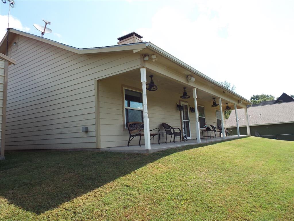 721 Midway Road Tool, TX 75143 - Photo 4 of 30 a view of a house with patio