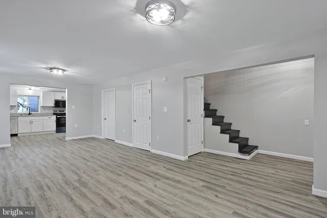 a view of a livingroom with wooden floor