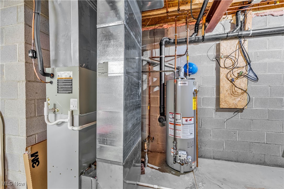 1033 Parsons Road Grafton, OH 44044 - Photo 21 of 25 Utility room featuring heating unit and gas water heater