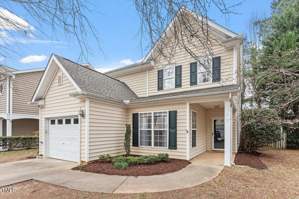 8412 Lunar Stone Place Raleigh, NC 27613 - Photo 3 of 28 a view of a white house next to a yard