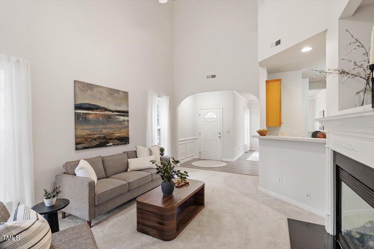 8412 Lunar Stone Place Raleigh, NC 27613 - Photo 8 of 28 a living room with furniture and a large window