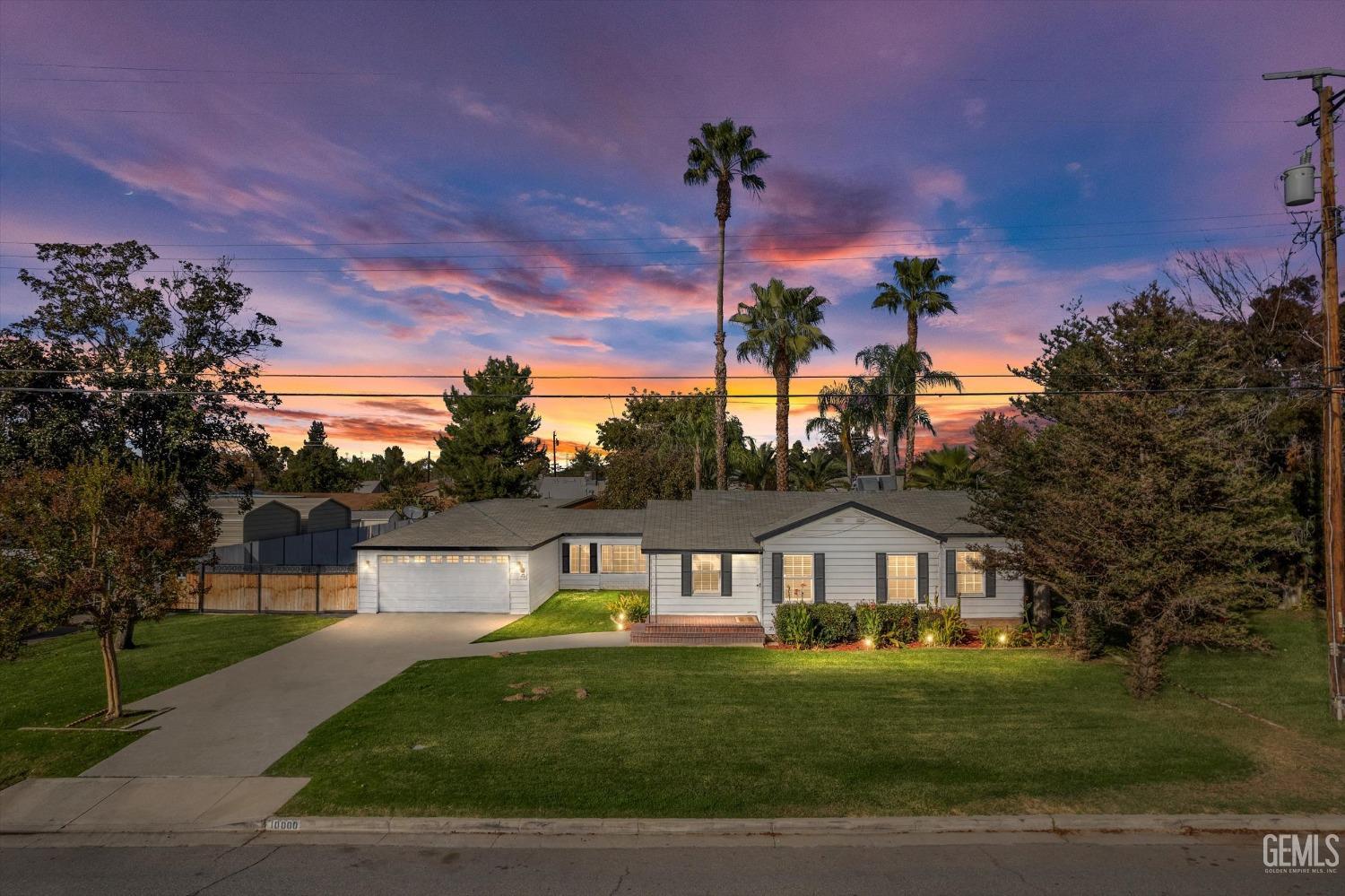 Undisclosed Address Bakersfield, CA 93312 - Photo 1 of 35 a front view of a house with a garden