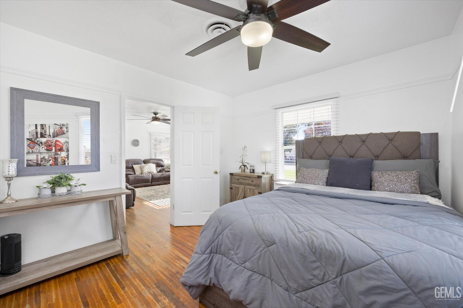 Undisclosed Address Bakersfield, CA 93312 - Photo 15 of 35 a spacious bedroom with a bed and ceiling fan