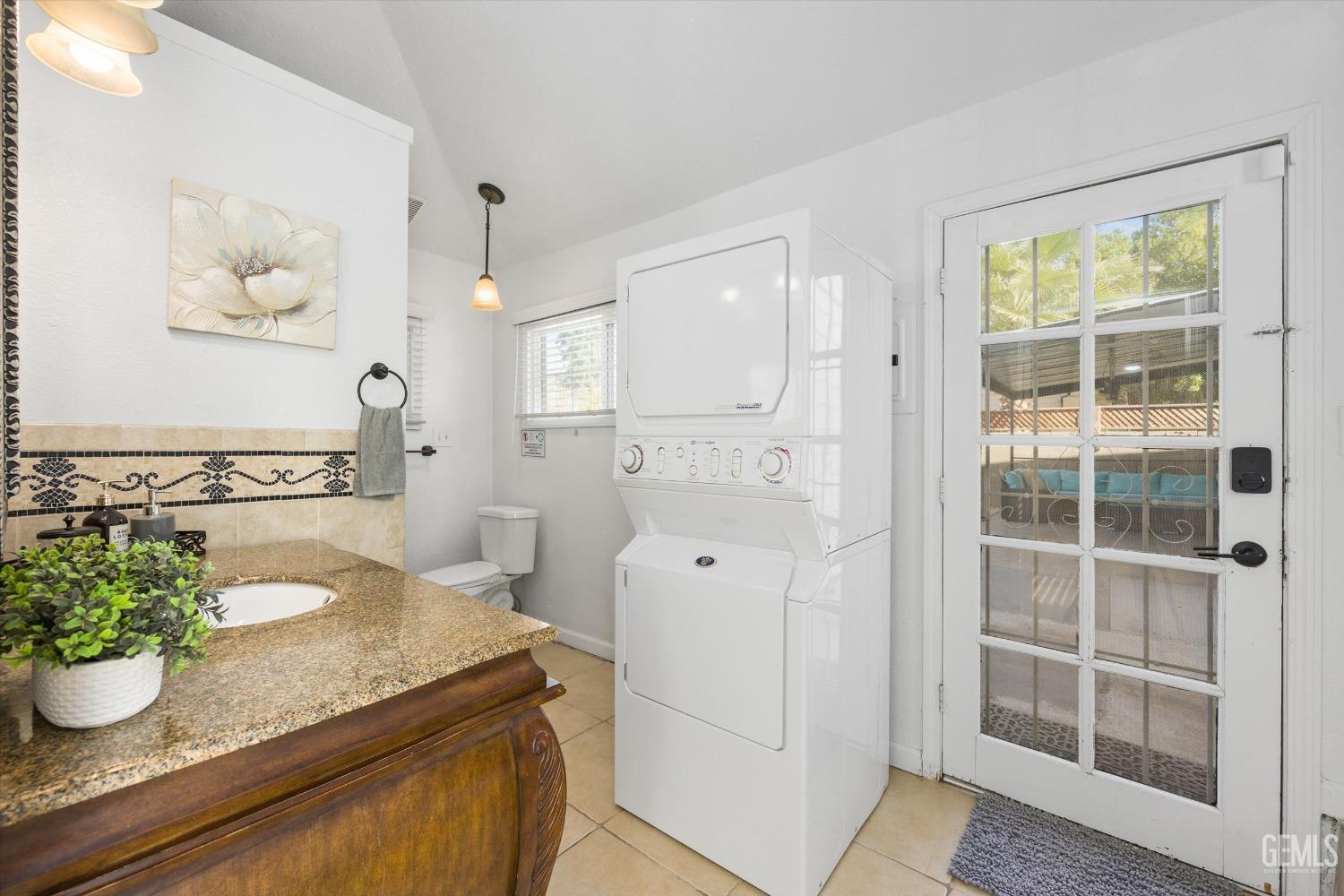 Undisclosed Address Bakersfield, CA 93312 - Photo 20 of 35 a spacious bathroom with a granite countertop sink and a potted plant