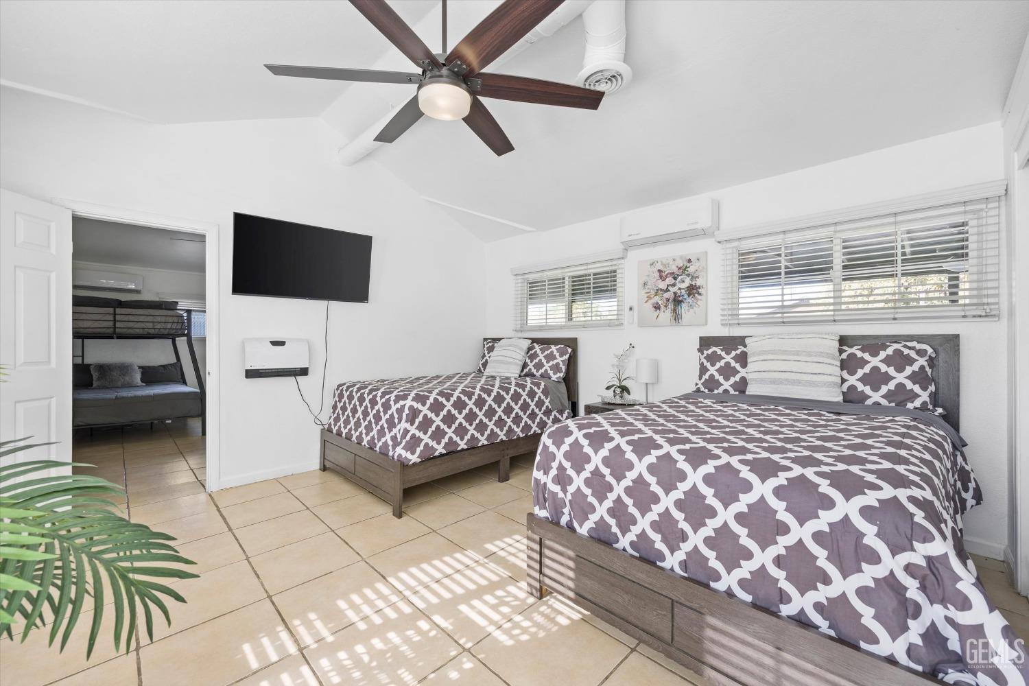 Undisclosed Address Bakersfield, CA 93312 - Photo 22 of 35 a bedroom with a bed and a television