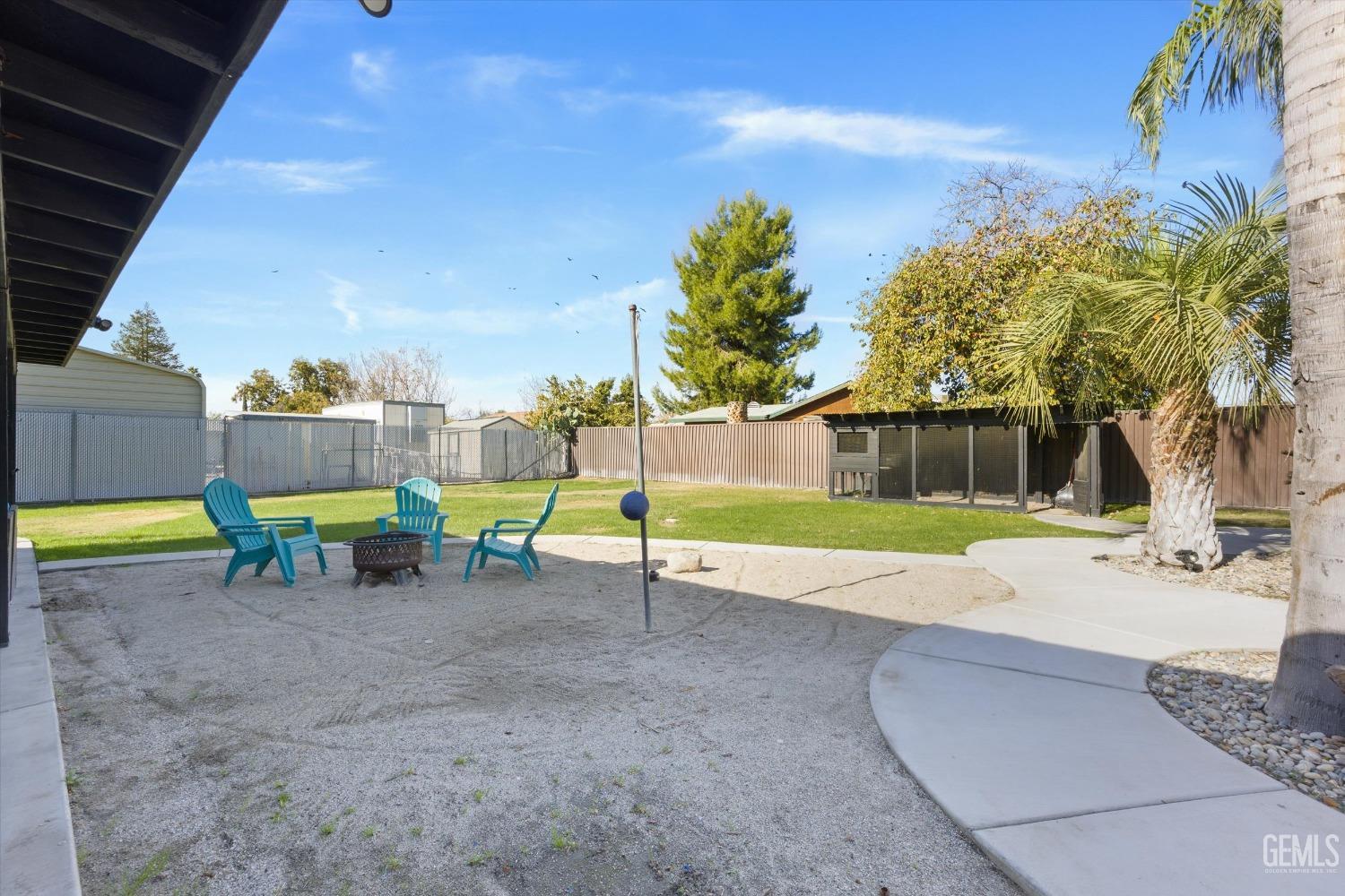 Undisclosed Address Bakersfield, CA 93312 - Photo 29 of 35 a view of a backyard with swimming pool
