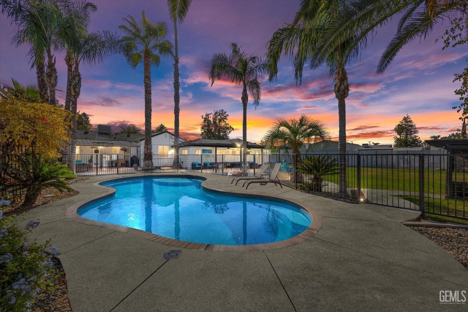 Undisclosed Address Bakersfield, CA 93312 - Photo 3 of 35 a view of a swimming pool with a lounge chair