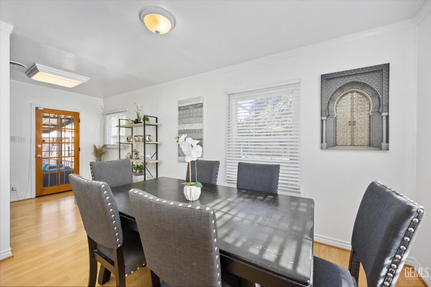 Undisclosed Address Bakersfield, CA 93312 - Photo 8 of 35 a view of a dining room with furniture window and wooden floor