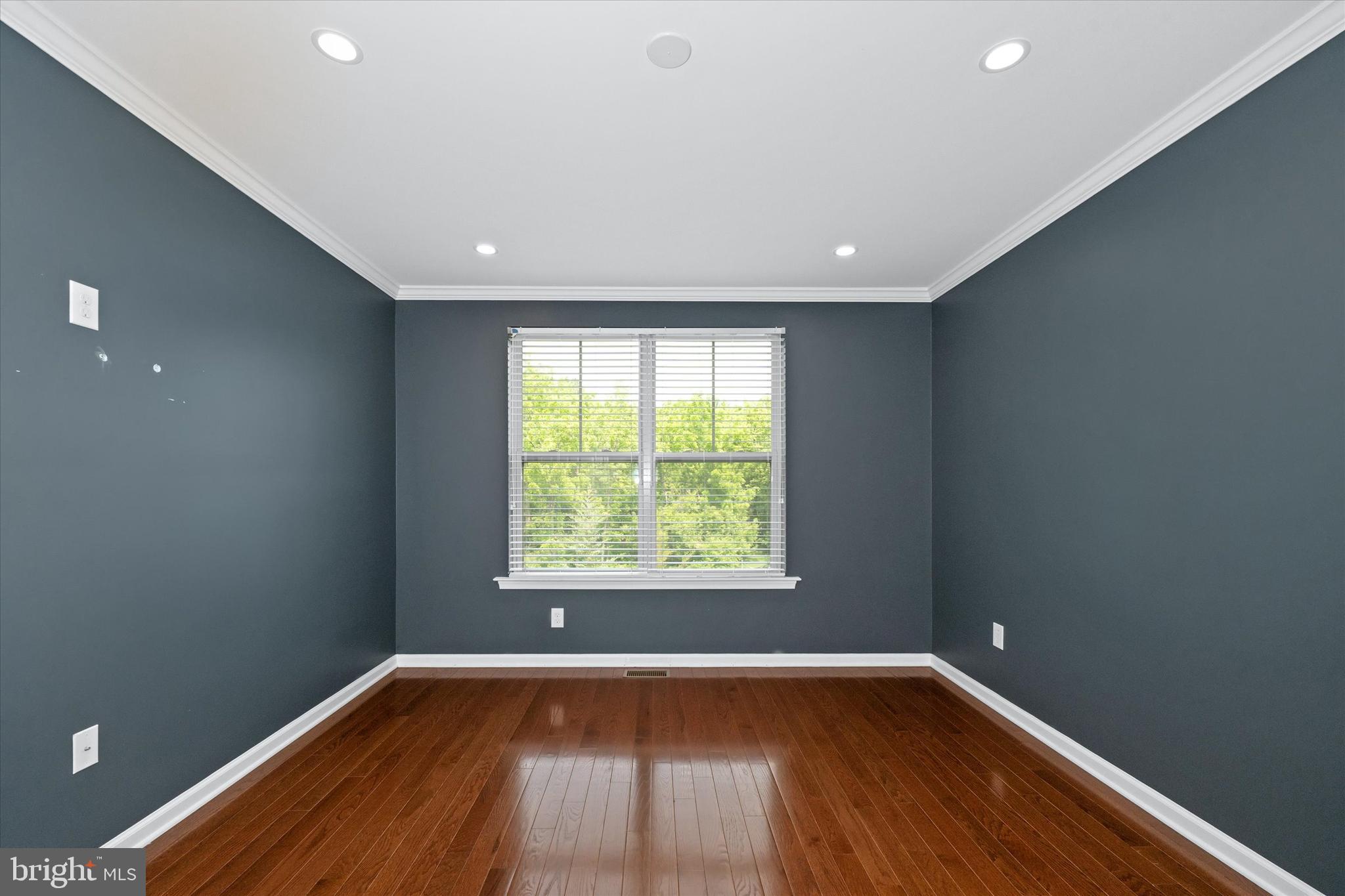 10 Chasmere Drive Kennett Square, PA 19348 - Photo 18 of 49 a view of an empty room with wooden floor and a window