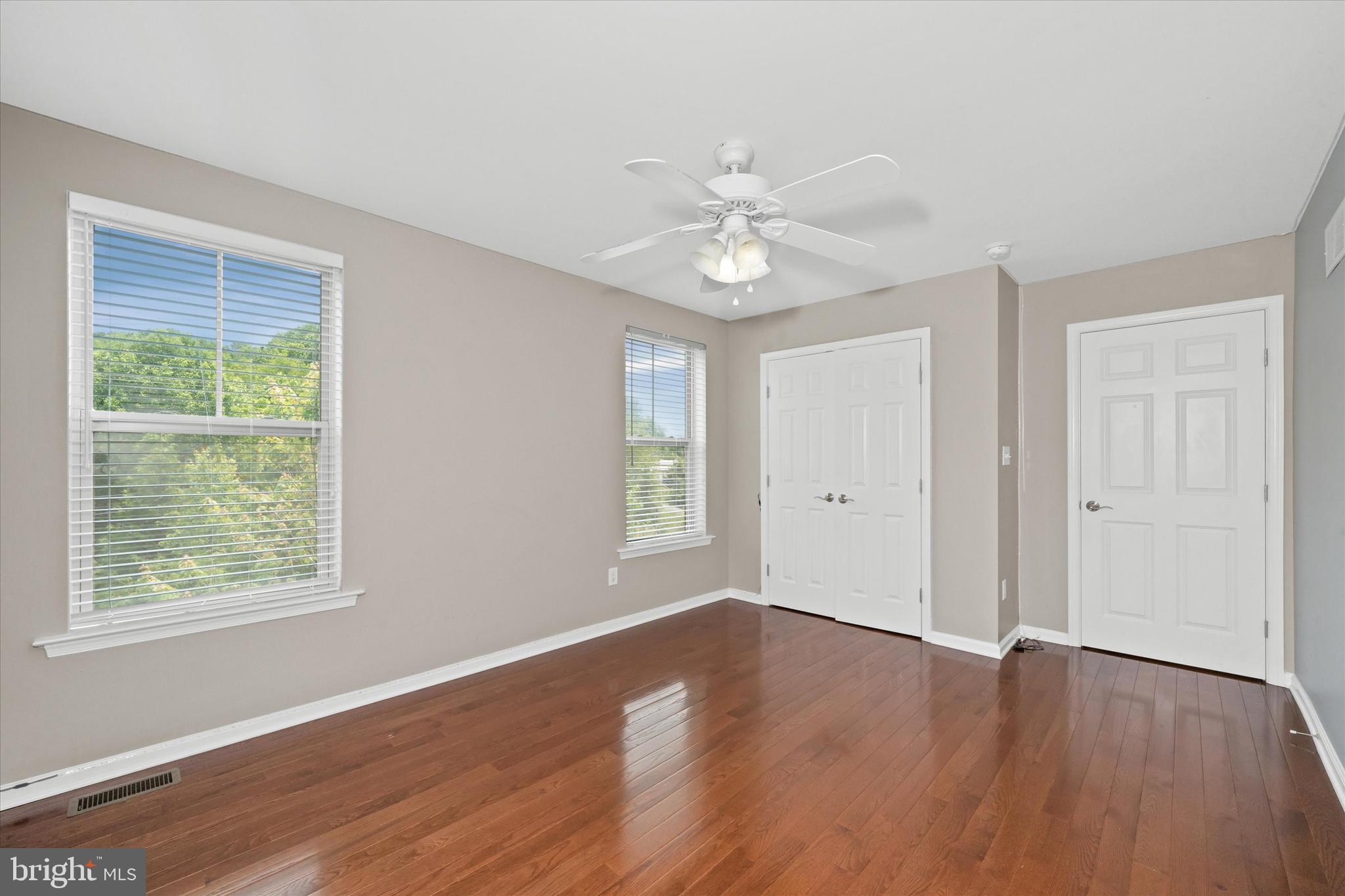 10 Chasmere Drive Kennett Square, PA 19348 - Photo 21 of 49 a view of an empty room with wooden floor and a window