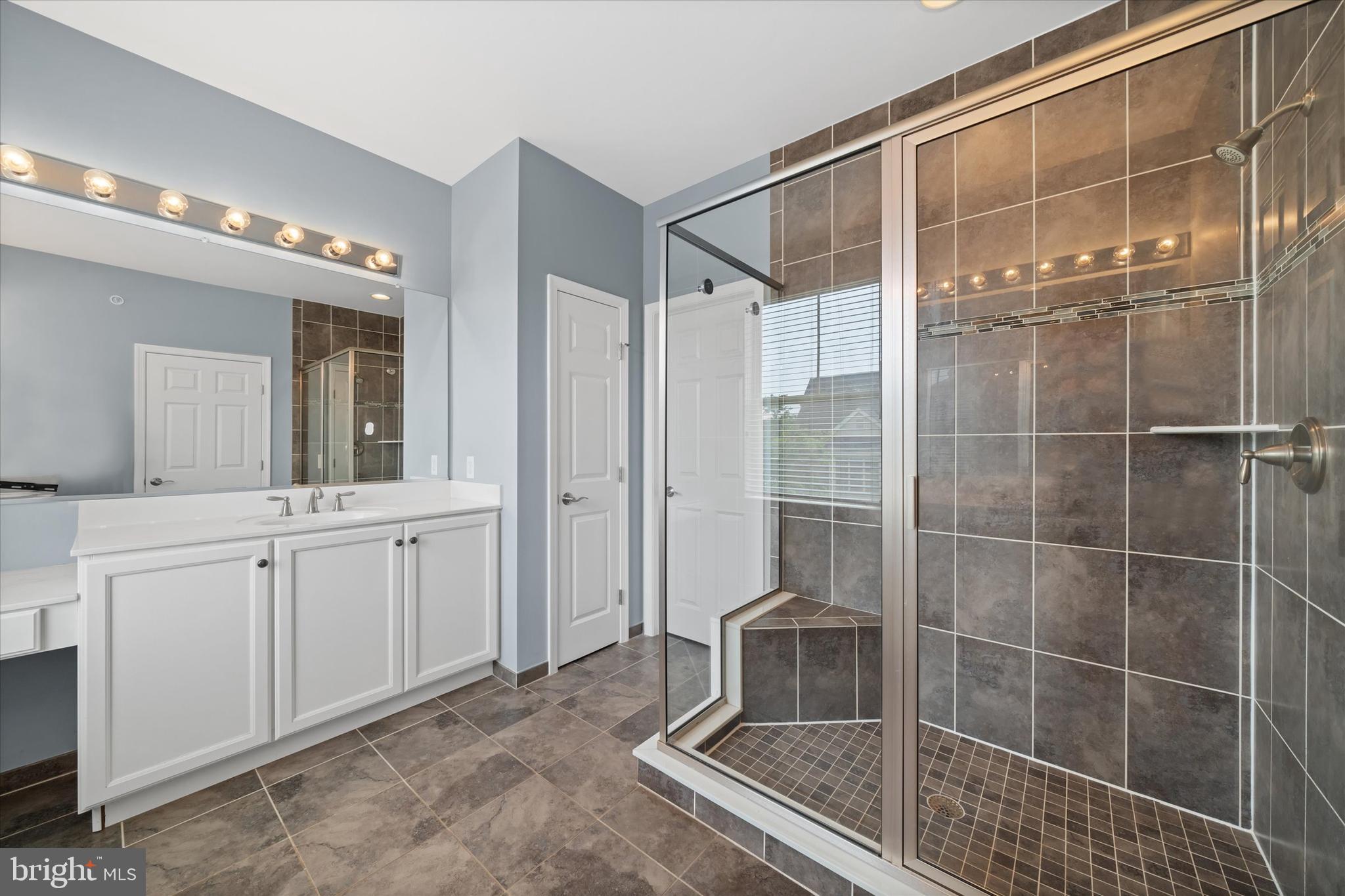 10 Chasmere Drive Kennett Square, PA 19348 - Photo 45 of 49 a bathroom with a shower sink and mirror