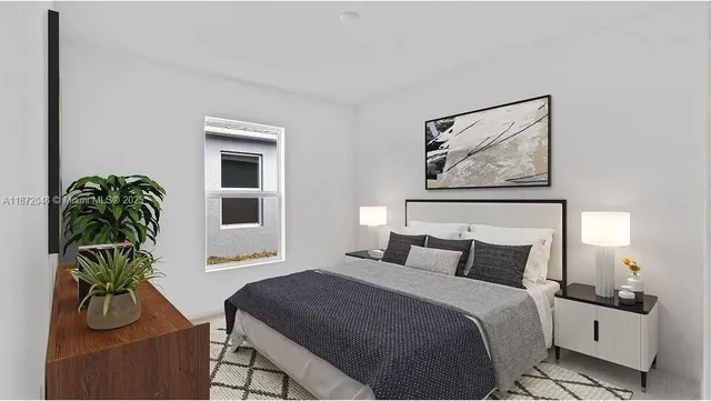 a bedroom with furniture and a potted plant