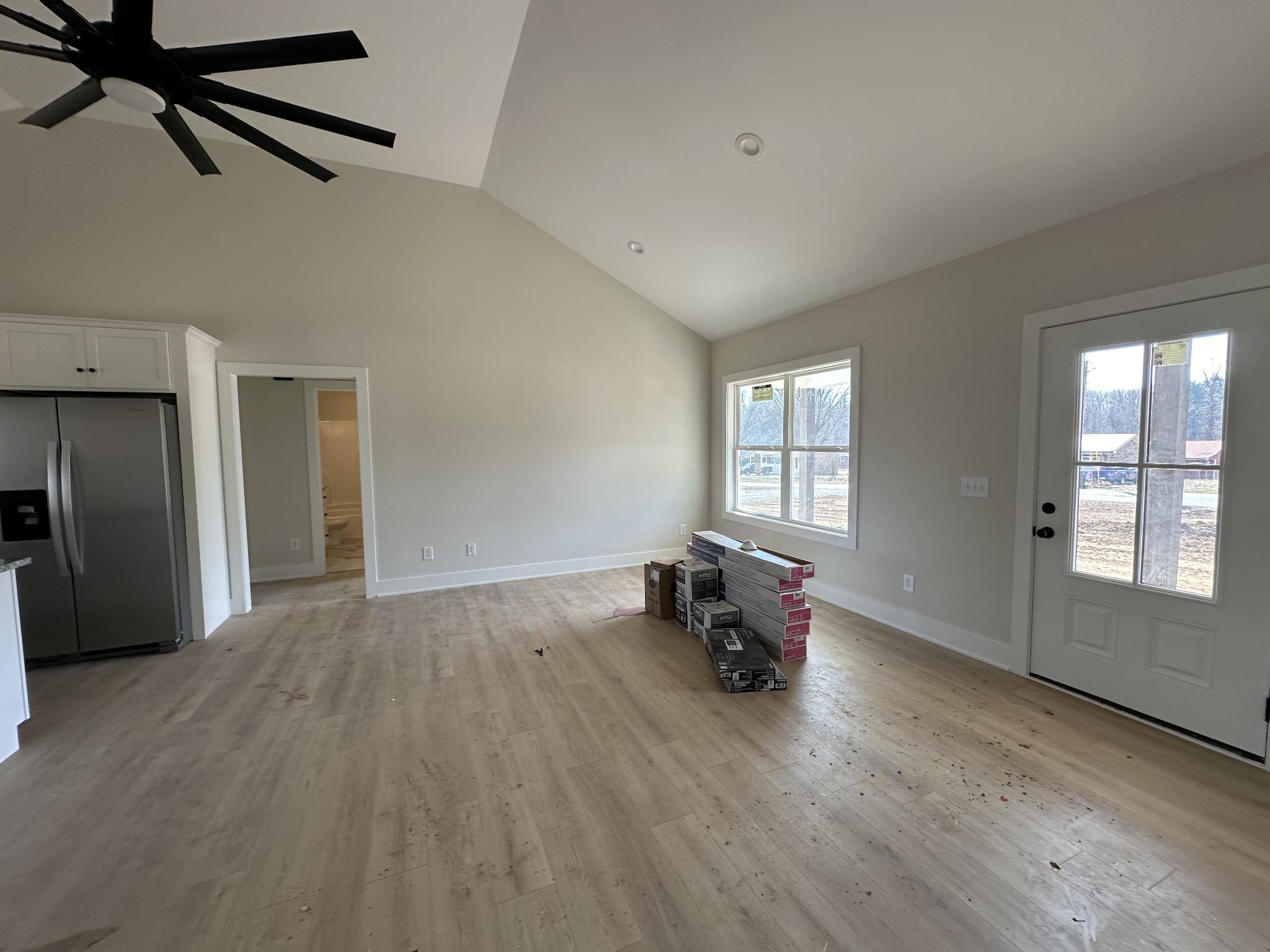 345 Jim Courtney Road Portland, TN 37148 - Photo 3 of 14 a view of empty room with wooden floor and fan