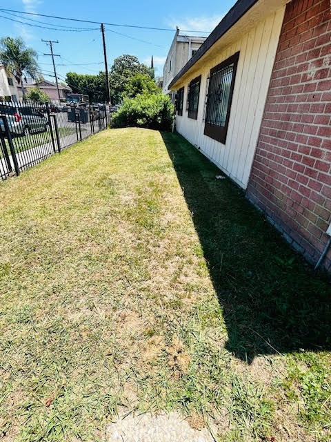 7304 Exeter Street, Unit E Paramount, CA 90723 - Photo 32 of 36 The front of the complex features a small grassy area that adds a touch of greenery.
