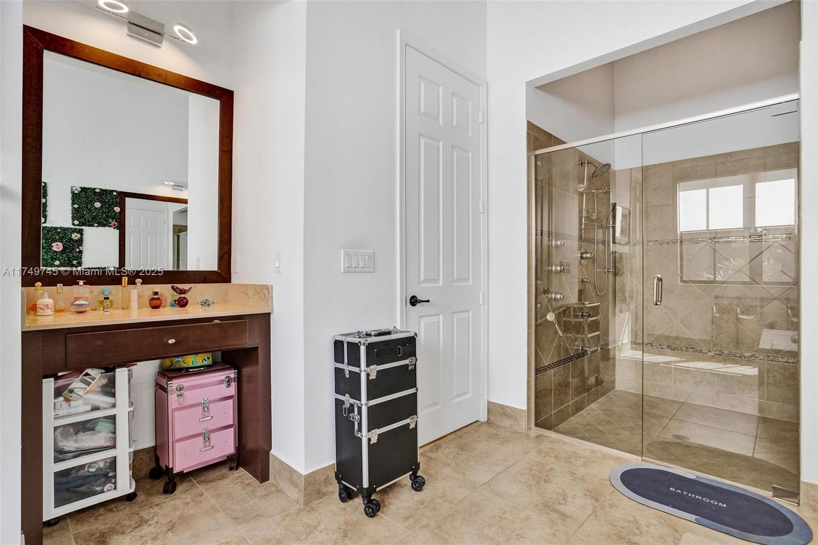 4455 Parkside Road Davie, FL 33328 - Photo 15 of 66 a bathroom with a double vanity sink and a mirror