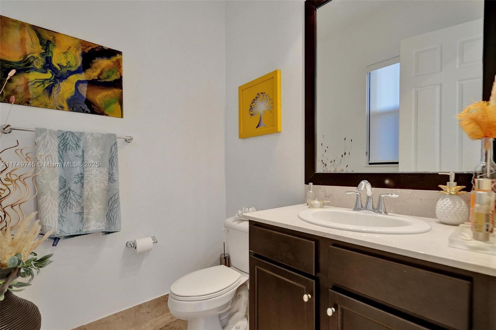 4455 Parkside Road Davie, FL 33328 - Photo 6 of 66 a bathroom with a sink and a mirror