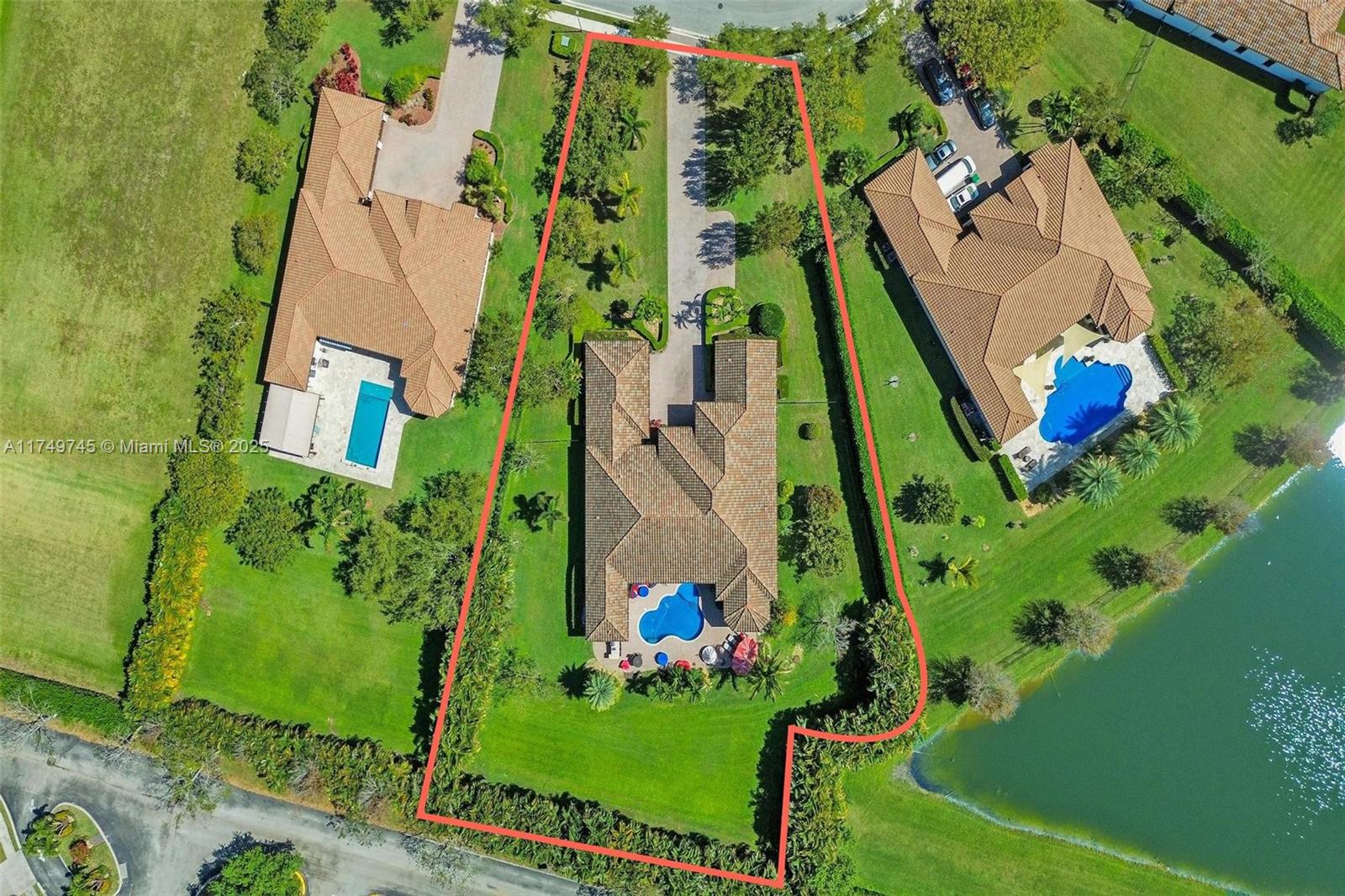 4455 Parkside Road Davie, FL 33328 - Photo 64 of 66 an aerial view of a residential houses with outdoor space and street view