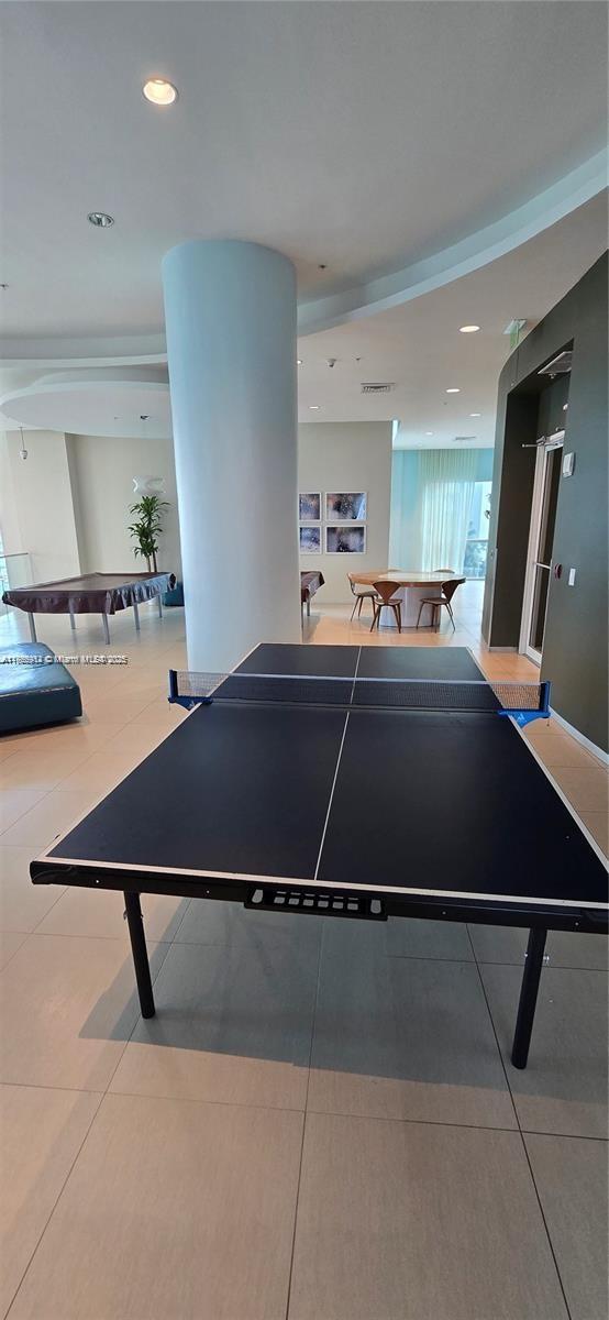Edgewater Miami, FL 33132 - Photo 17 of 52 a living room with a bed furniture and painting on the wall