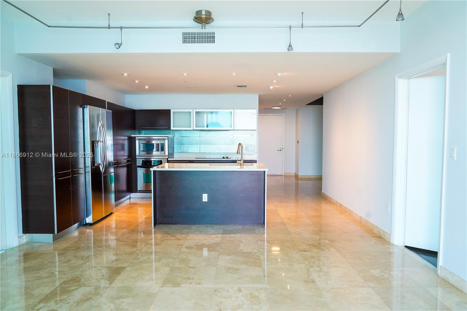 Edgewater Miami, FL 33132 - Photo 18 of 52 a view of kitchen with refrigerator and window