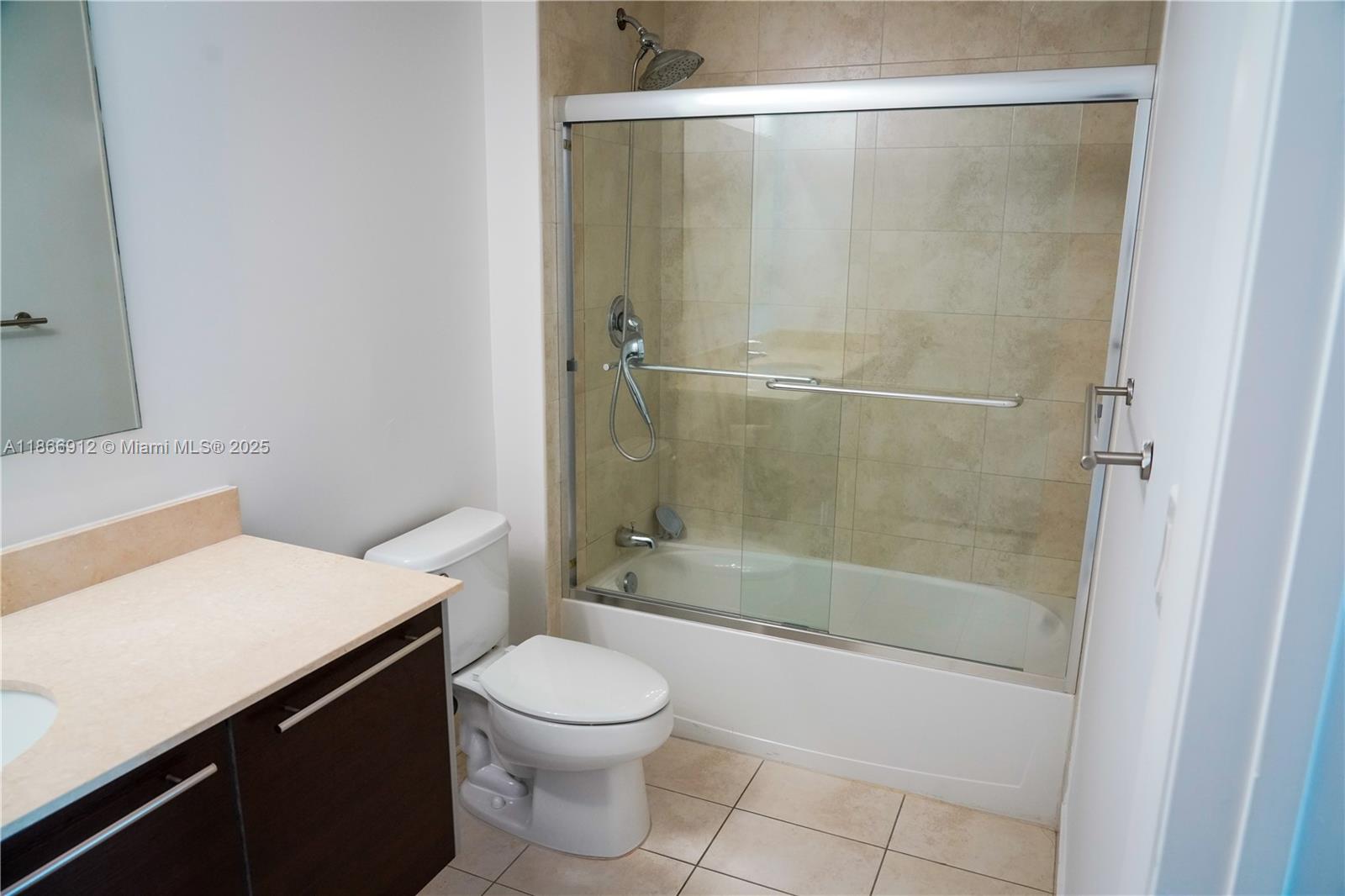 Edgewater Miami, FL 33132 - Photo 26 of 52 a bathroom with a shower a toilet and sink