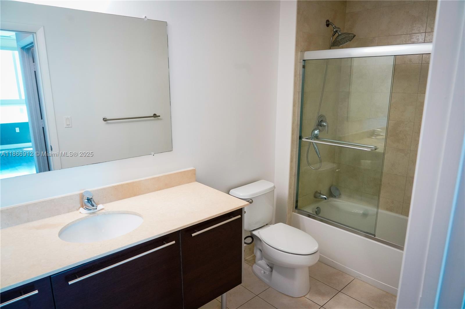 Edgewater Miami, FL 33132 - Photo 27 of 52 a bathroom with a sink a toilet and shower