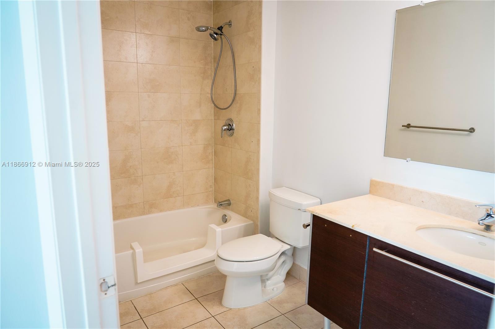 Edgewater Miami, FL 33132 - Photo 30 of 52 a bathroom with a toilet a sink and a shower