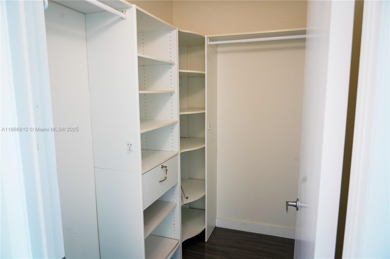 Edgewater Miami, FL 33132 - Photo 32 of 52 a view of walk in closet with empty racks