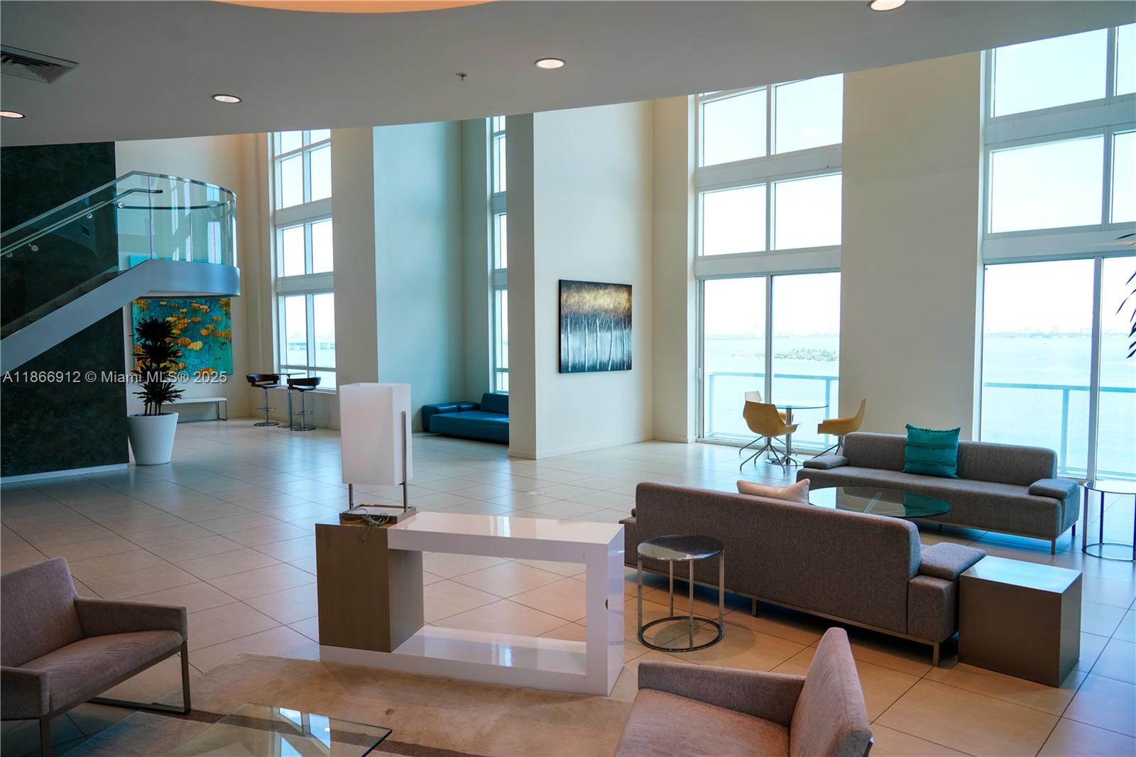 Edgewater Miami, FL 33132 - Photo 34 of 52 a living room with fireplace furniture and a large window