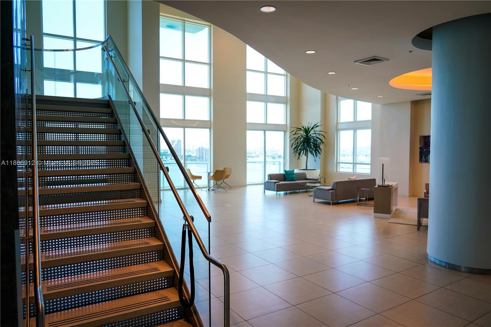 Edgewater Miami, FL 33132 - Photo 35 of 52 a view of a living room with balcony and furniture