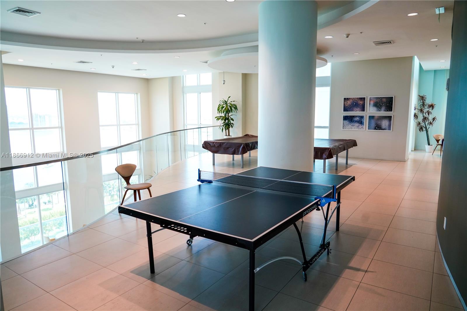 Edgewater Miami, FL 33132 - Photo 38 of 52 a view of a dining room with furniture and a potted plant