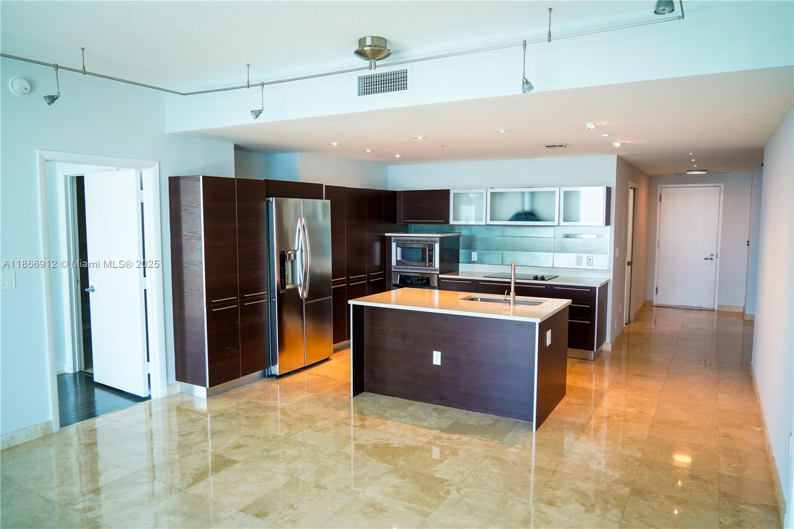 Edgewater Miami, FL 33132 - Photo 45 of 52 a large kitchen with stainless steel appliances granite countertop a refrigerator and a sink