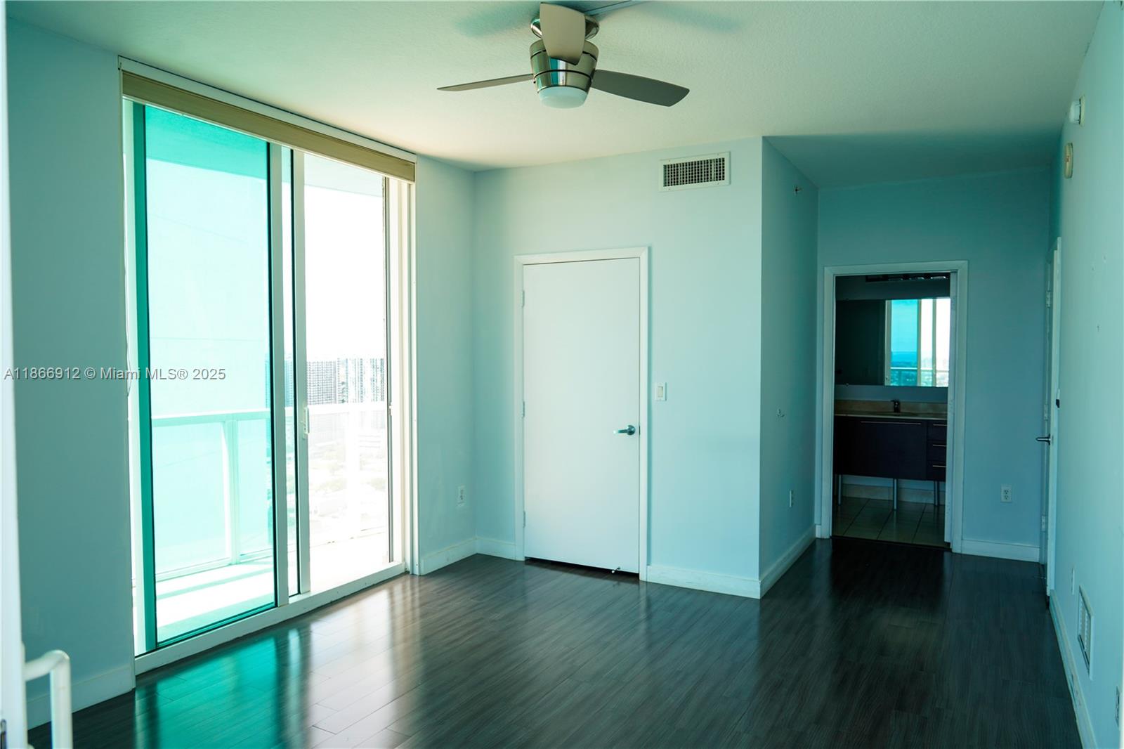 Edgewater Miami, FL 33132 - Photo 49 of 52 a view of a hallway with wooden floor and a bathroom